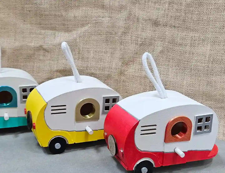 Top-down view of a retro camper birdhouse, illustrating the roof design and the bird entrance hole.