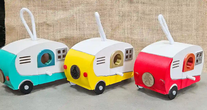 Rear view of a retro camper birdhouse, showing the back panel and realistic artistic touches.